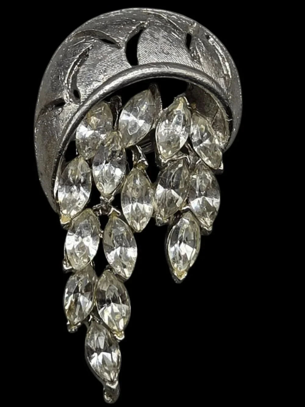None this brooch